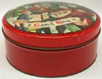 a%20round%2C%20red-coloured%20cookie%20tin%20with%20Christmas%20scene%20on%20lid